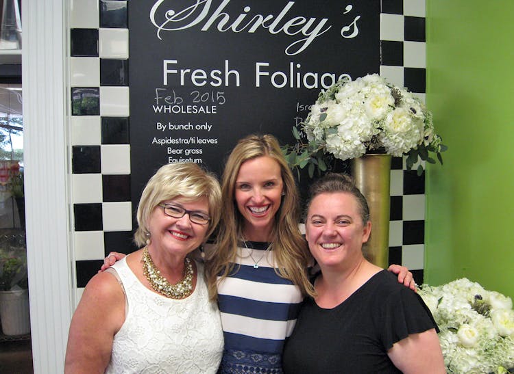 Trisha, Shelby and Jo share a happy moment during a fresh foliage sale